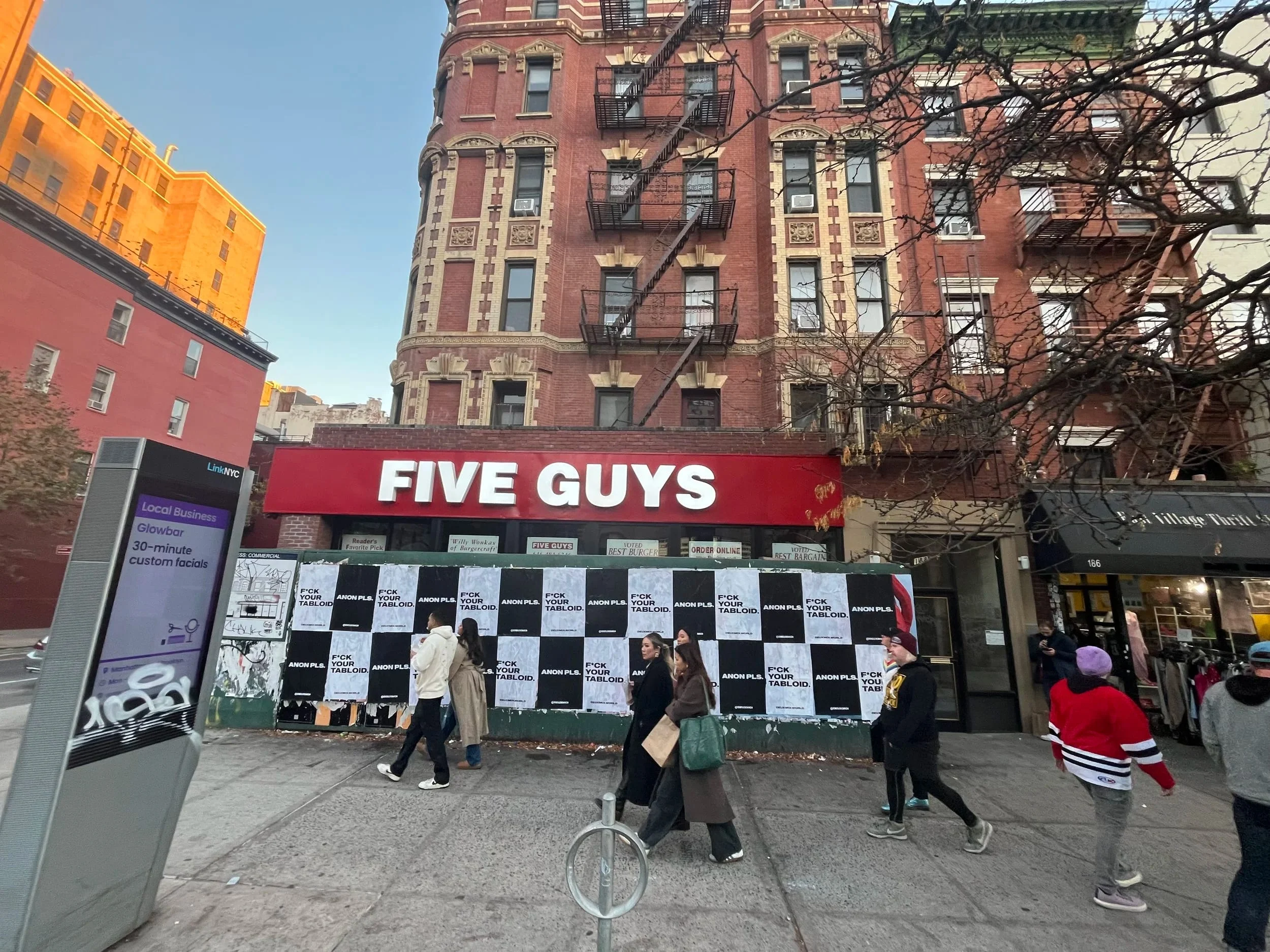 Anon Pls 'F*CK YOUR TABLOID' wheatpaste on construction hoarding in New York City, NY