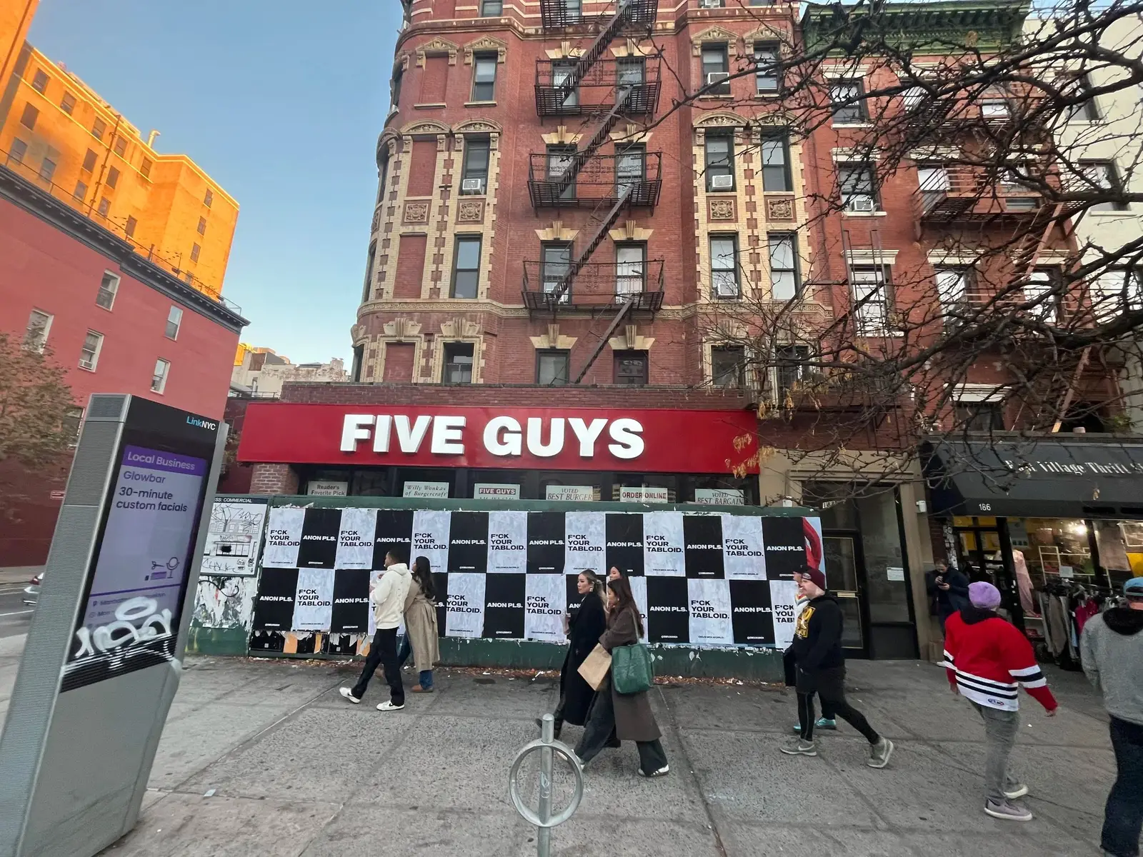 Anon Pls 'F*CK YOUR TABLOID' wheatpaste on construction hoarding in New York City, NY (photo 1 of 2).