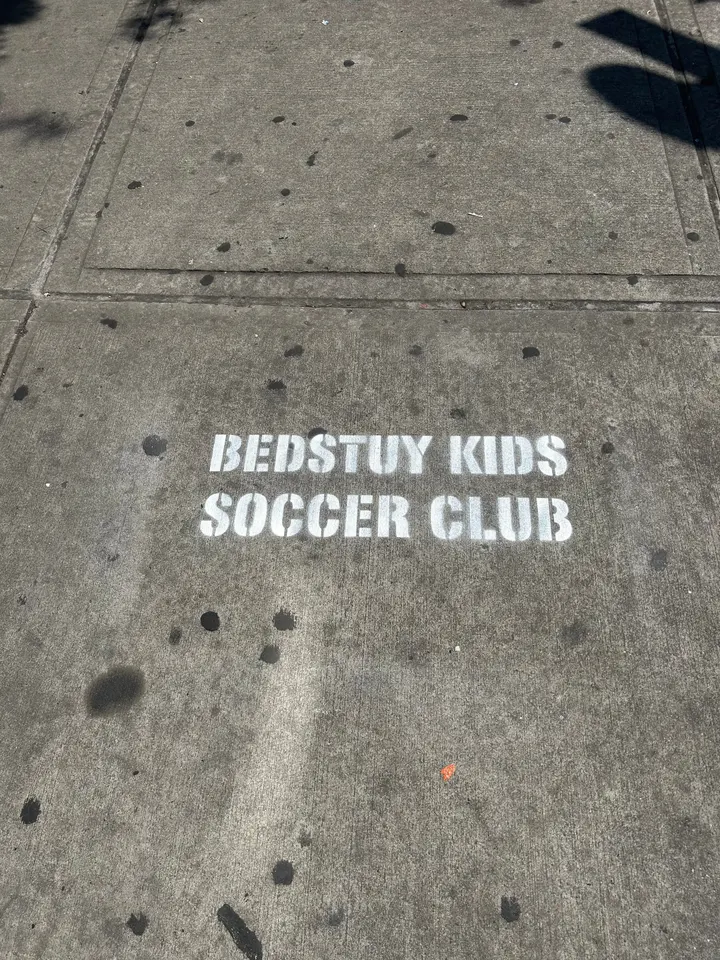 Sidewalk stencil for Bedstuy Kids Soccer Club in Bed-Stuy, Brooklyn NY by Beyond Street Media