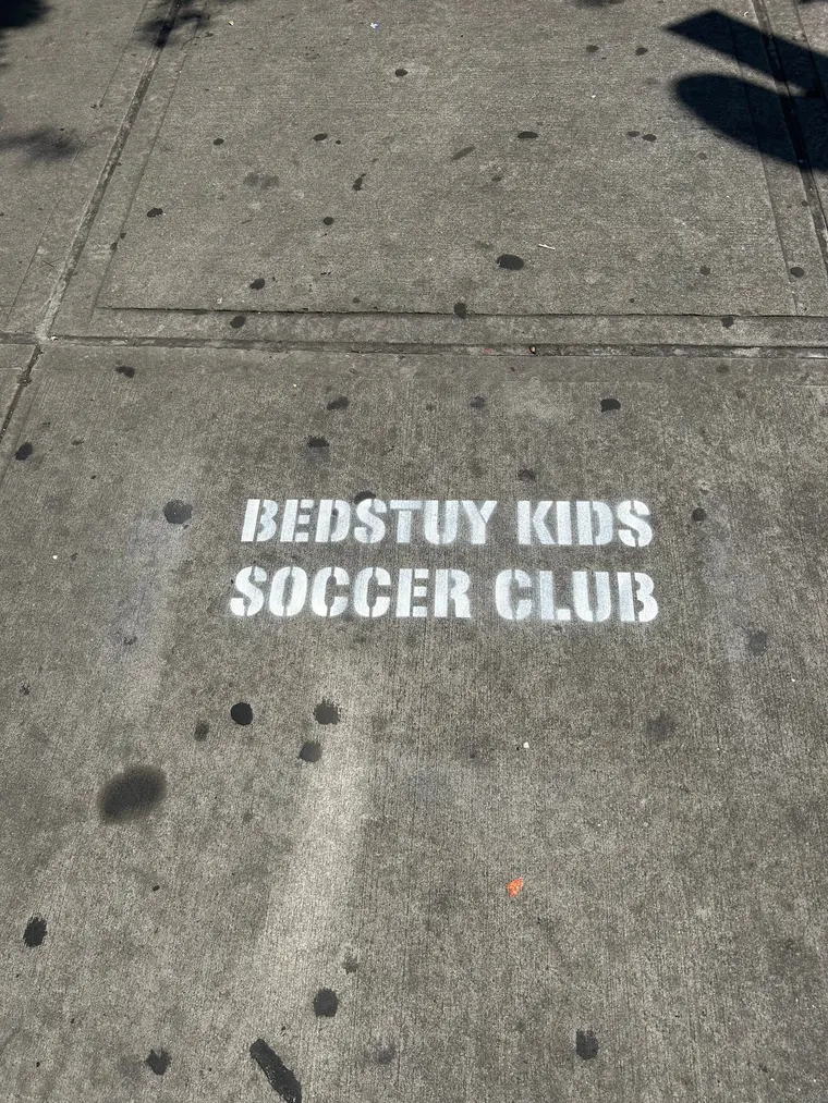 Sidewalk stencil for Bedstuy Kids Soccer Club in Bed-Stuy, Brooklyn NY by Beyond Street Media