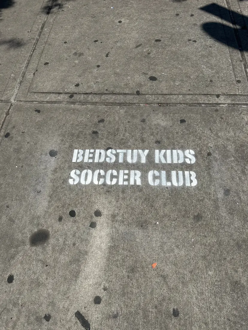 Sidewalk stencil for Bedstuy Kids Soccer Club in Bed-Stuy, Brooklyn NY by Beyond Street Media