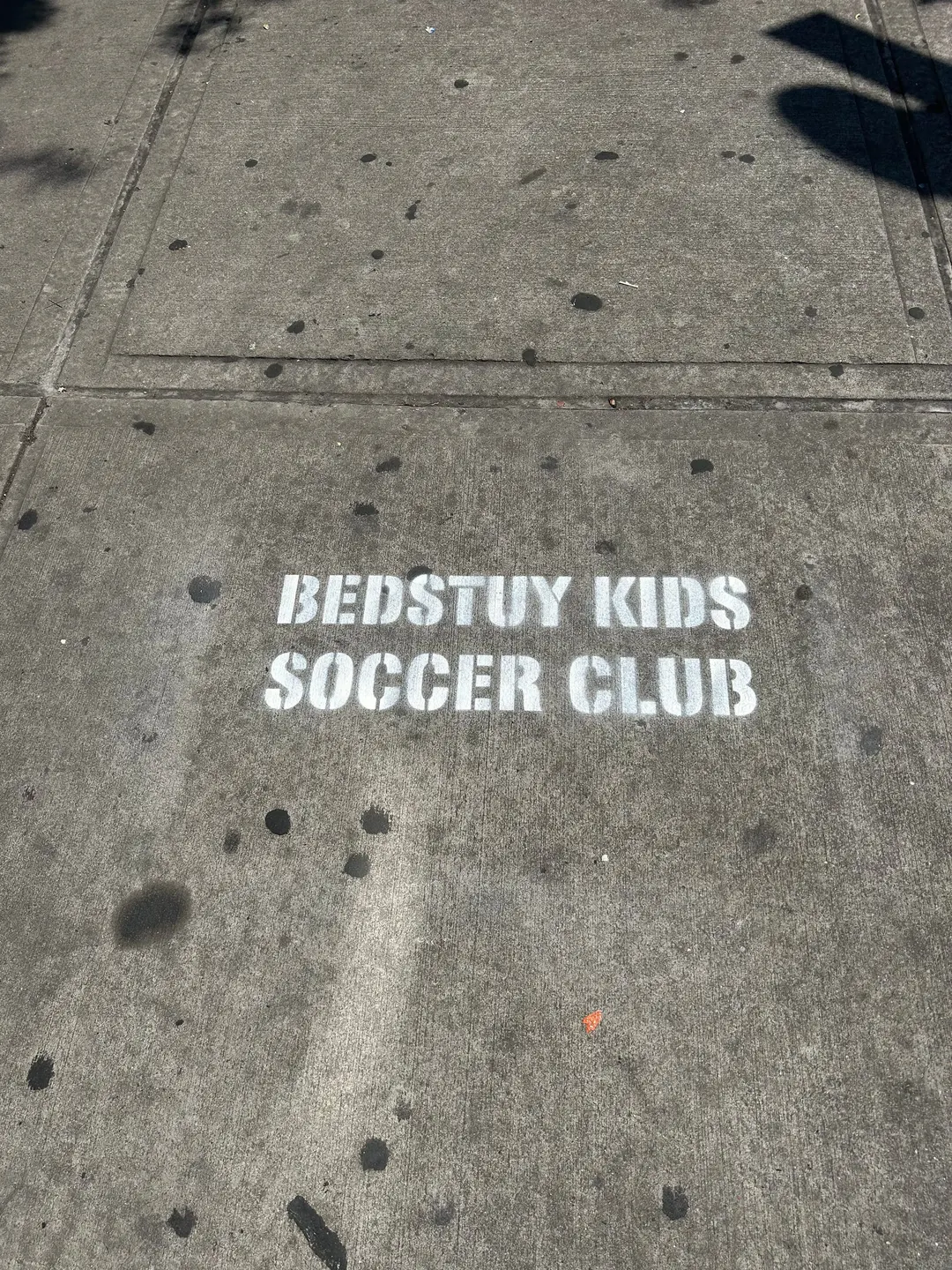 Sidewalk stencil for Bedstuy Kids Soccer Club in Bed-Stuy, Brooklyn NY by Beyond Street Media (photo 1 of 10).