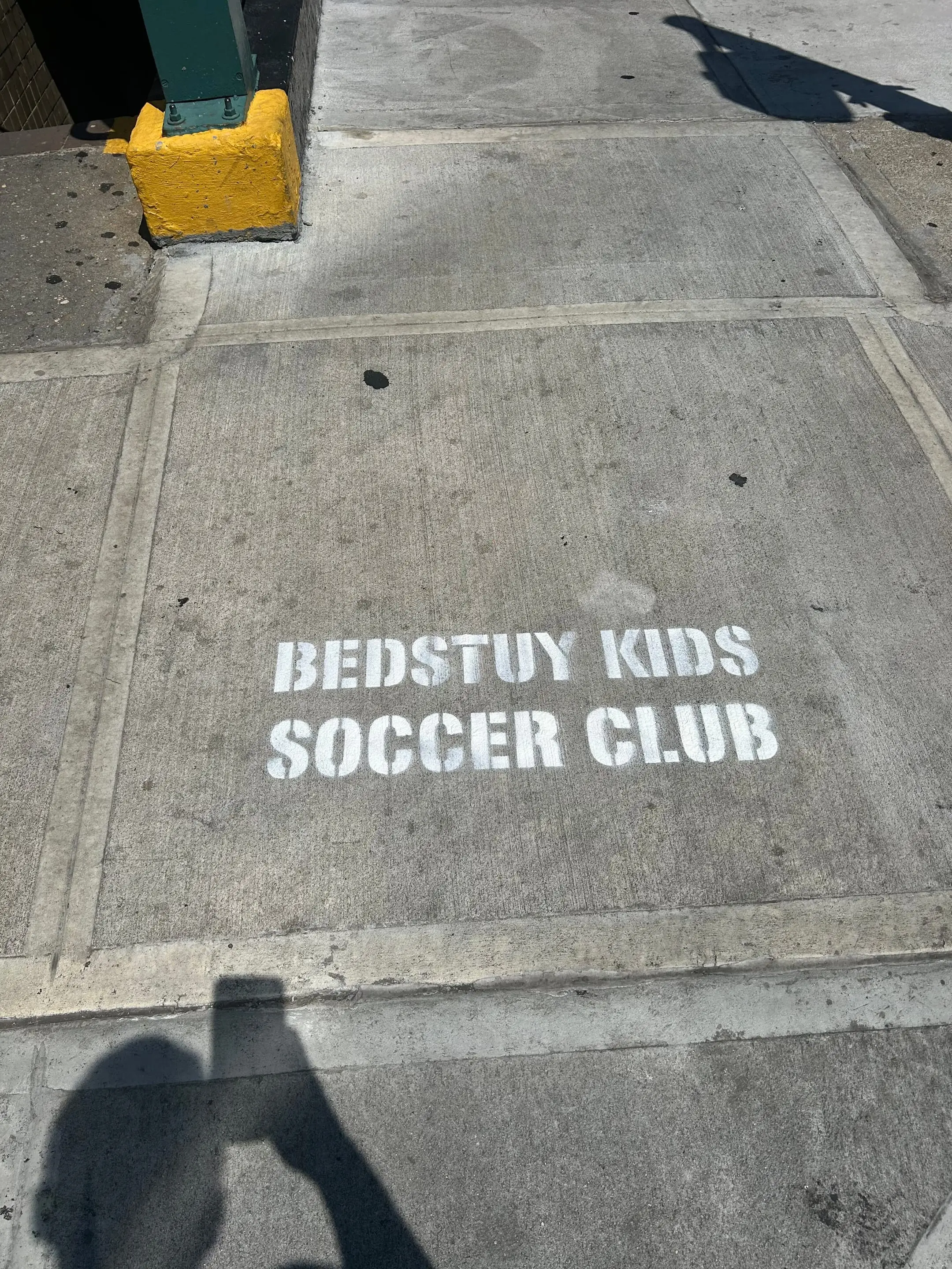 Sidewalk stencil for Bedstuy Kids Soccer Club in Bed-Stuy, Brooklyn NY by Beyond Street Media