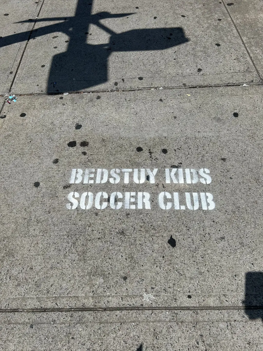 Sidewalk stencil for Bedstuy Kids Soccer Club in Bed-Stuy, Brooklyn NY by Beyond Street Media (photo 4 of 10).