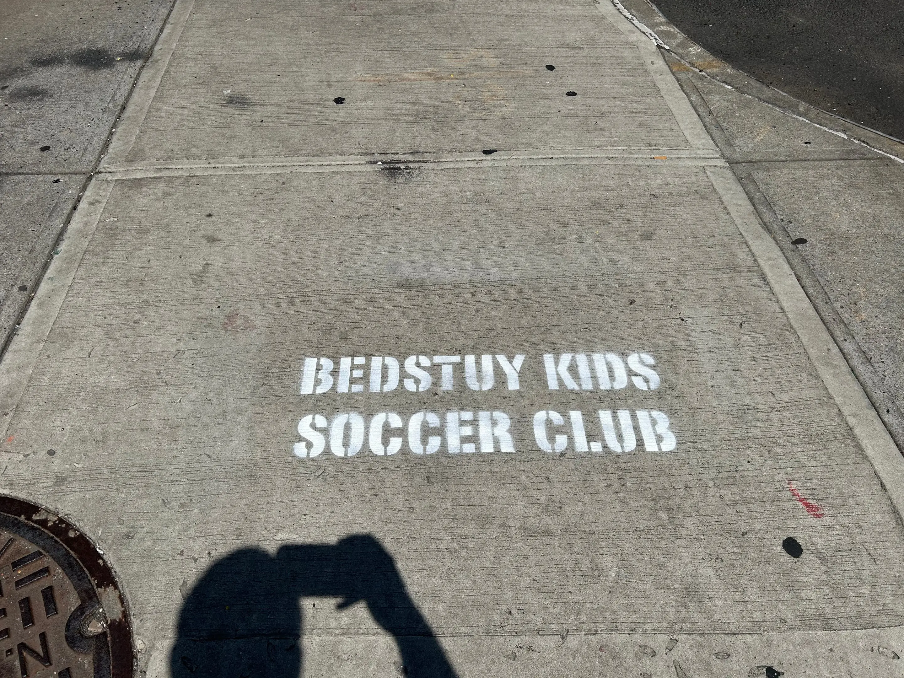 Sidewalk stencil for Bedstuy Kids Soccer Club in Bed-Stuy, Brooklyn NY by Beyond Street Media
