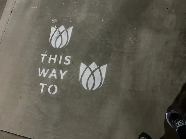 Sidewalk stencil install for Bloomeffects 'Tulip Powered Skincare' on New York City sidewalk in New York City - white stencil with tulip flower mark on concrete by Beyond Street Media (photo 6 of 12).