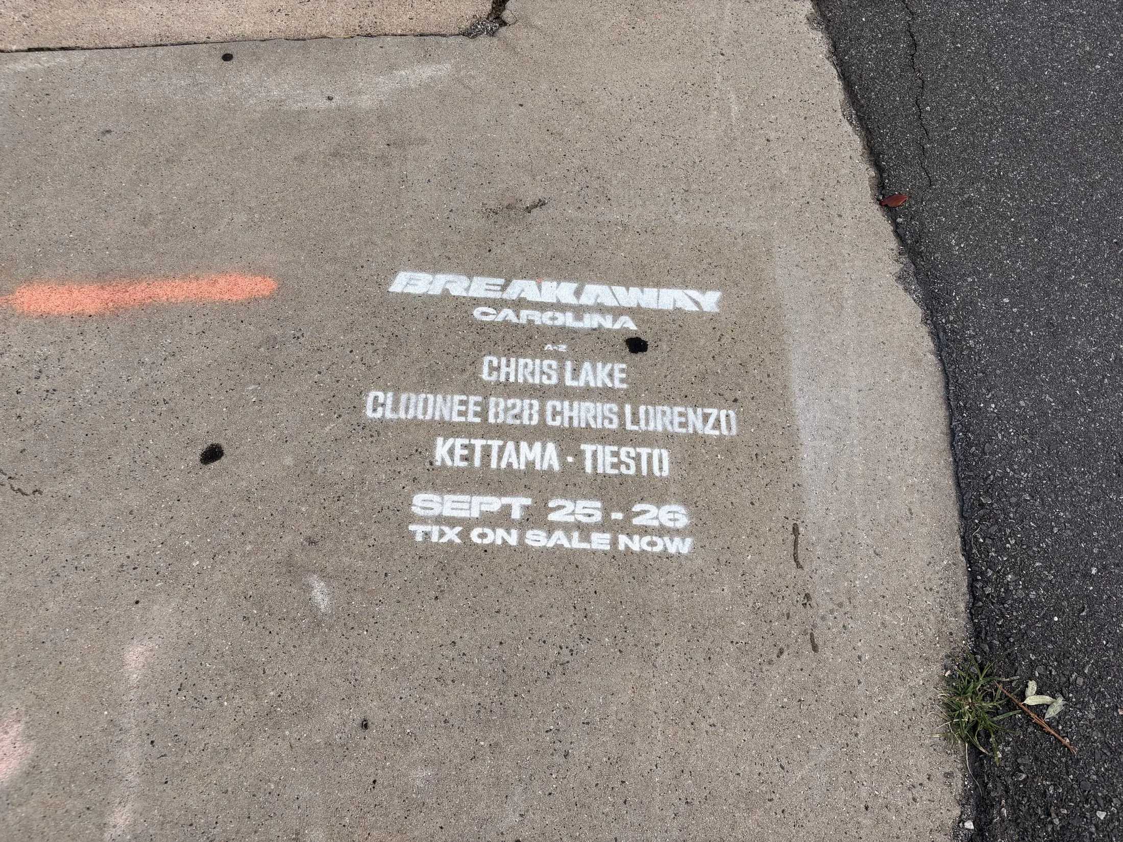 Sidewalk stencil for Breakaway Music Festival painted on the N Brevard St sidewalk, Charlotte NC