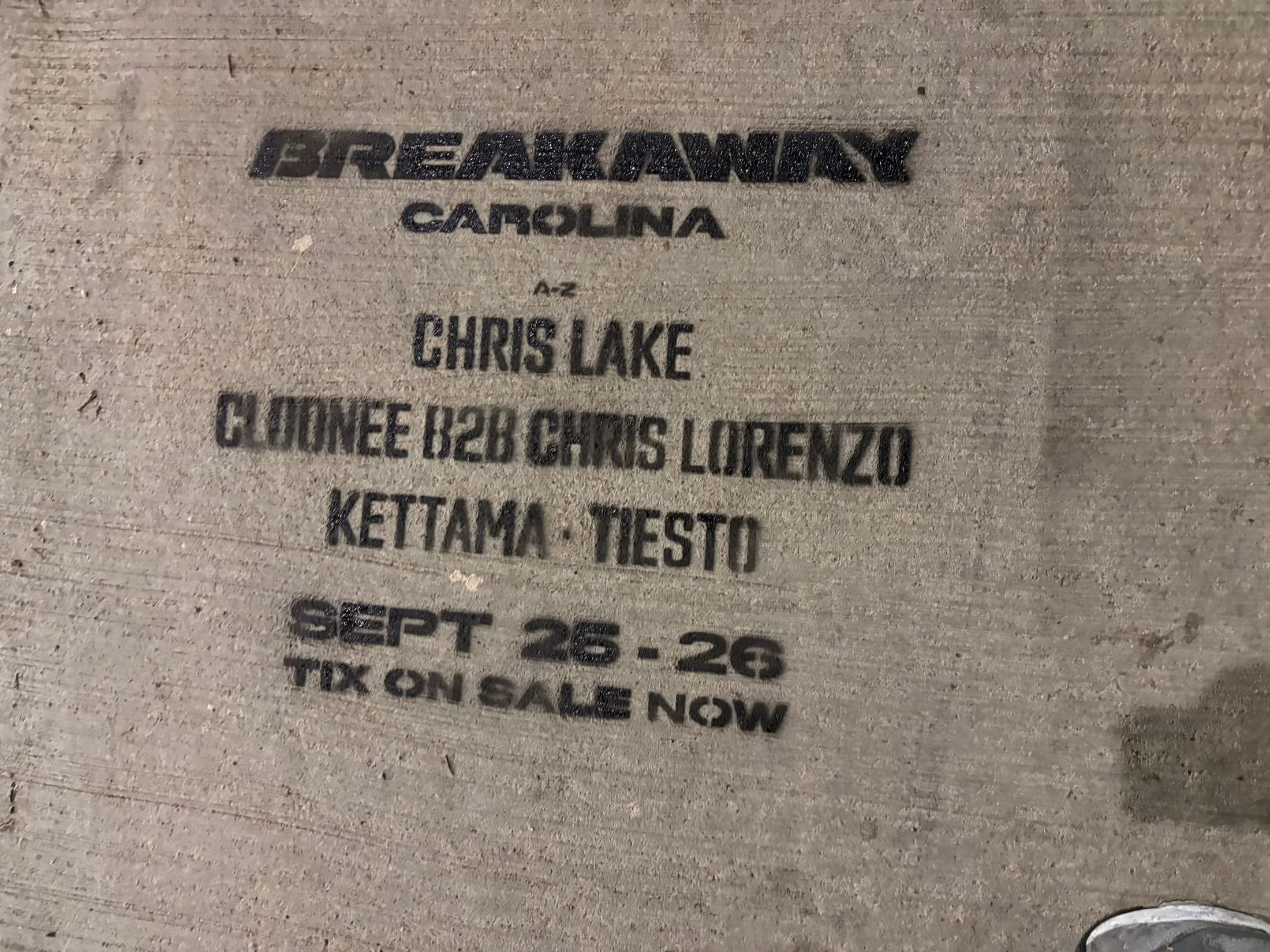 Close-up chalk stencil with the Breakaway Carolina lineup on the stadium block of Mint St, Charlotte