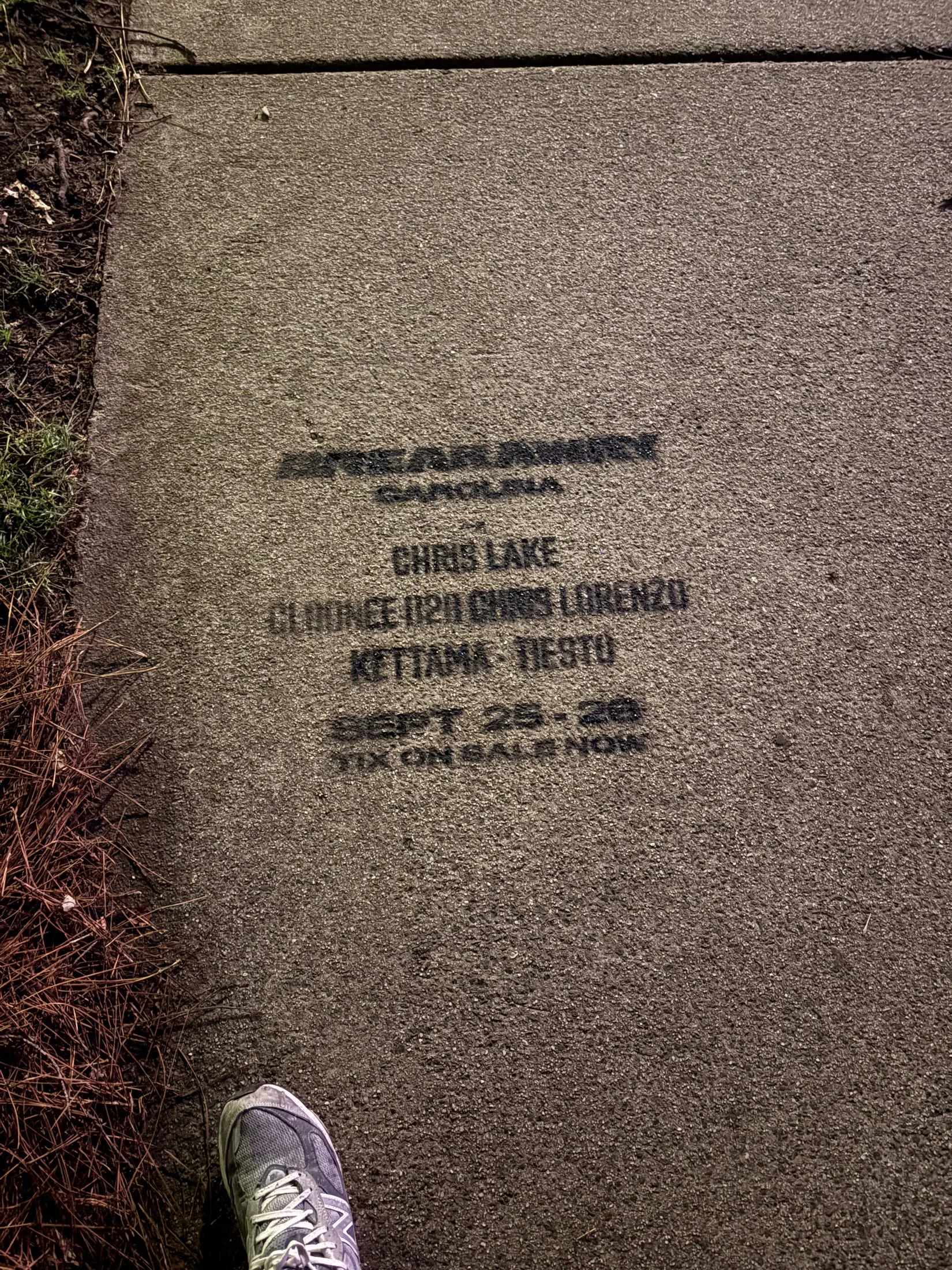 Sidewalk stencil for Breakaway Carolina with a pedestrian's shoe for scale, Cleveland Ave, South End Charlotte