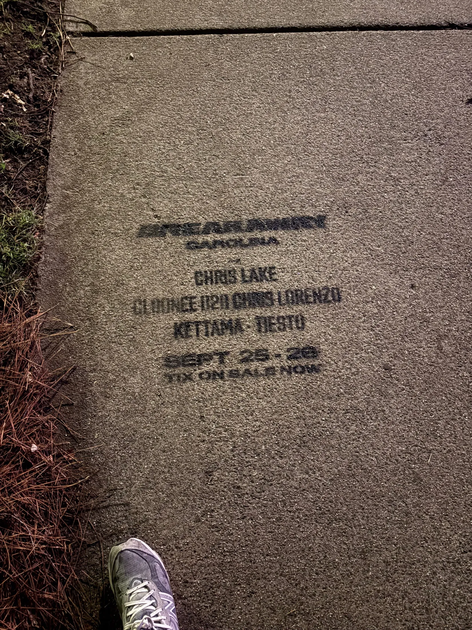 Sidewalk stencil for Breakaway Carolina with a pedestrian's shoe for scale, Cleveland Ave, South End Charlotte