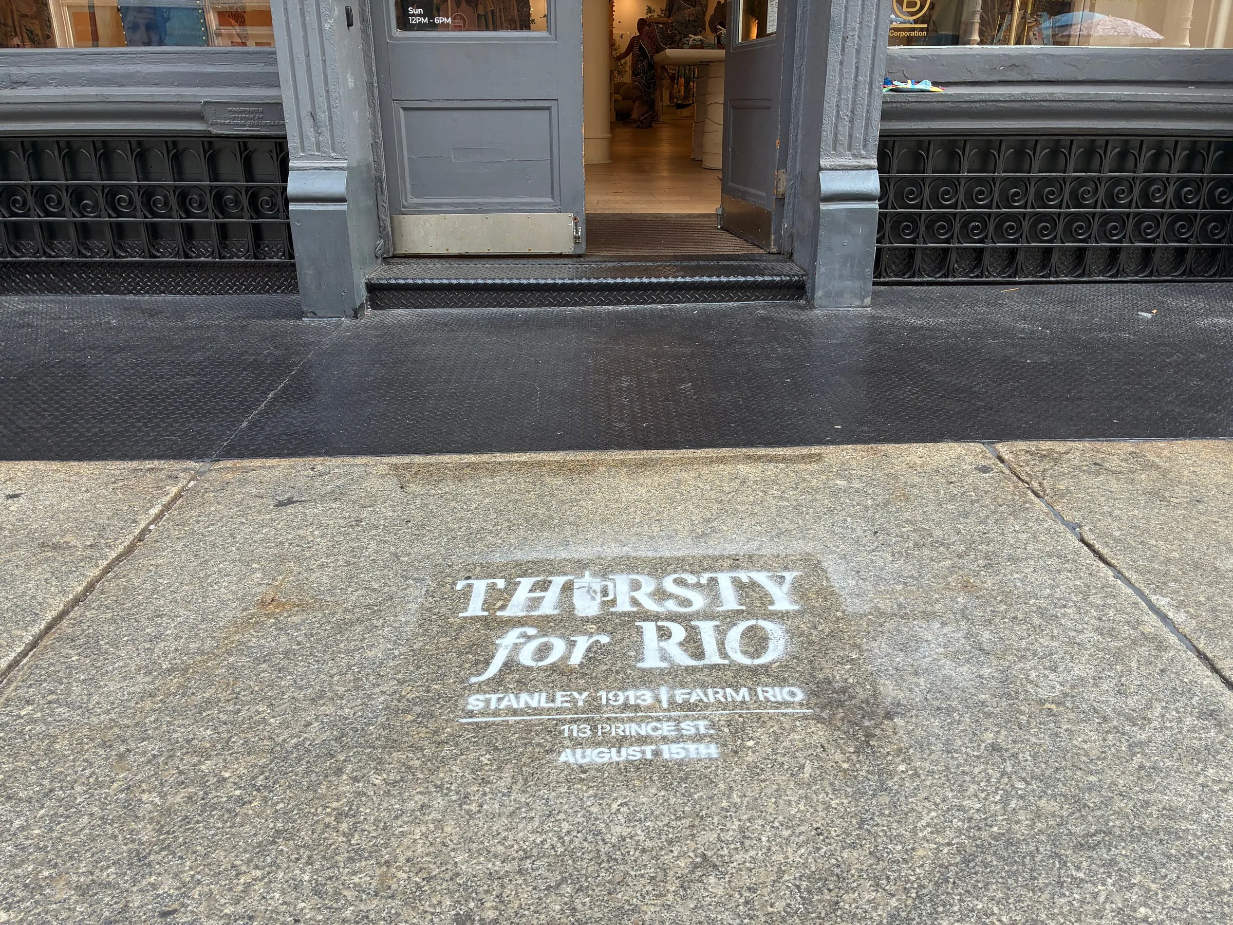 Chalk stencil on the sidewalk at the Farm Rio SoHo storefront doorway on Prince St.