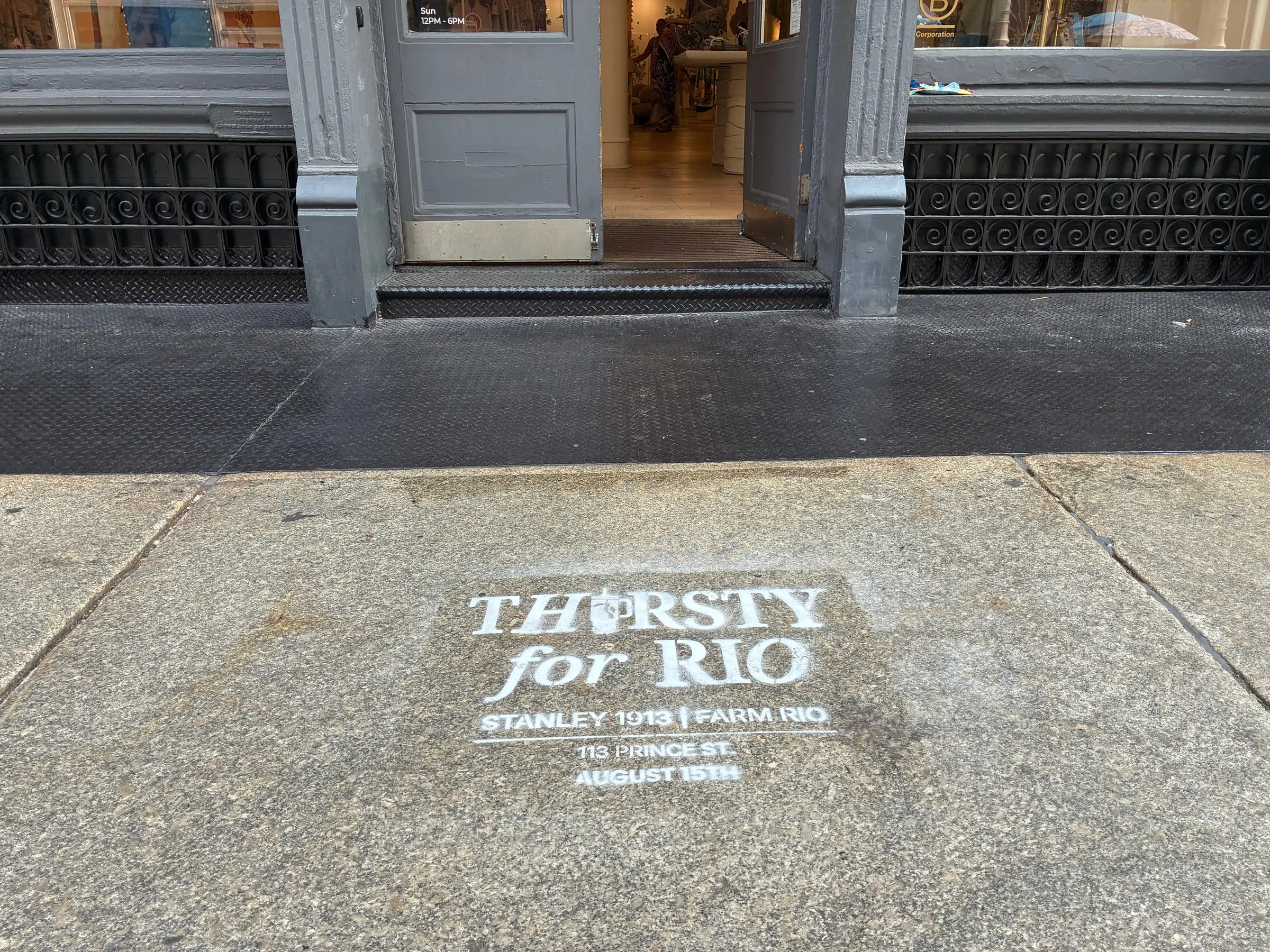 Chalk stencil on the sidewalk at the Farm Rio SoHo storefront doorway on Prince St.