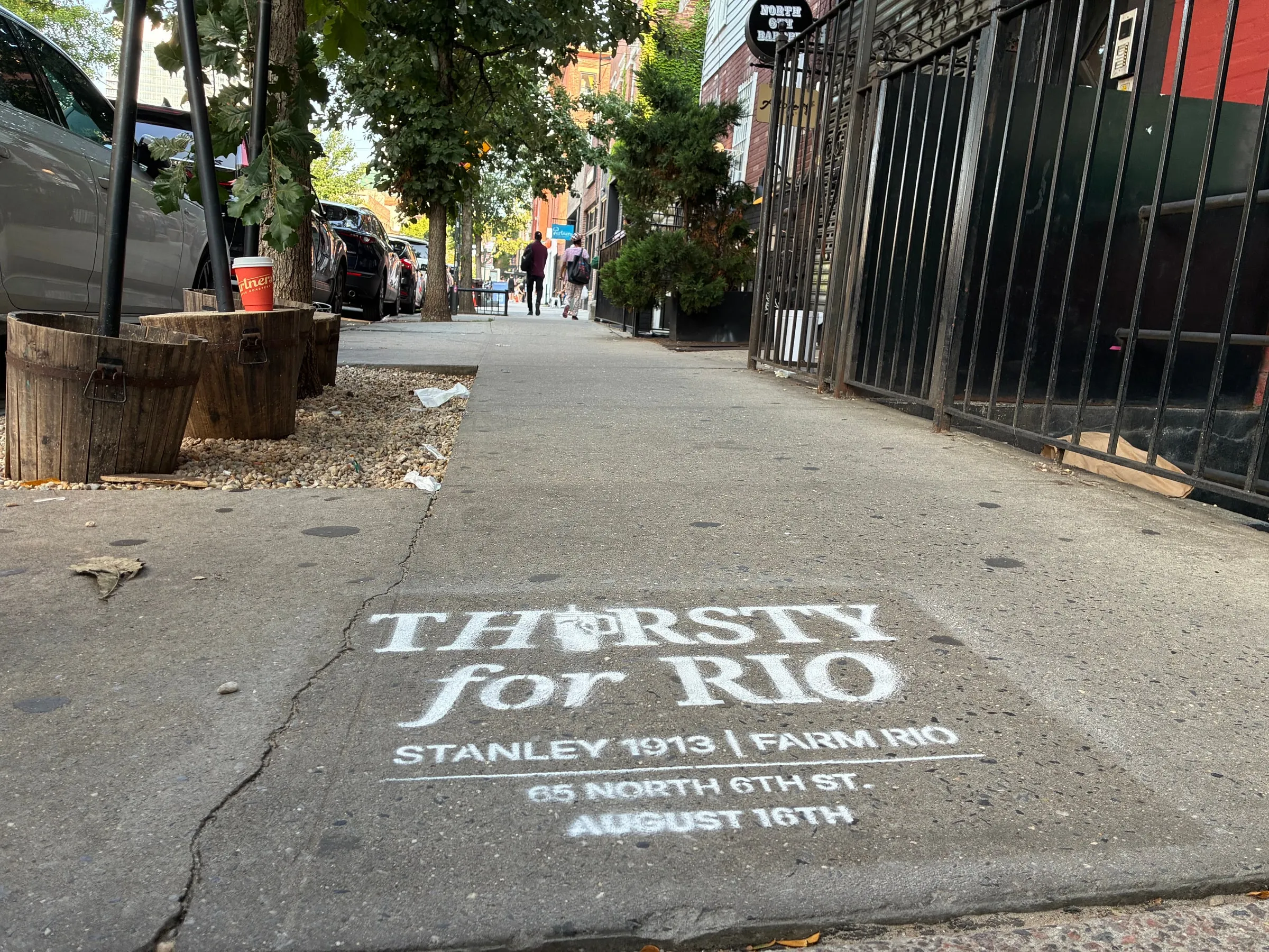 Farm Rio x Stanley 1913 Thirsty for Rio chalk stencil installed on a New York sidewalk by Beyond Street Media