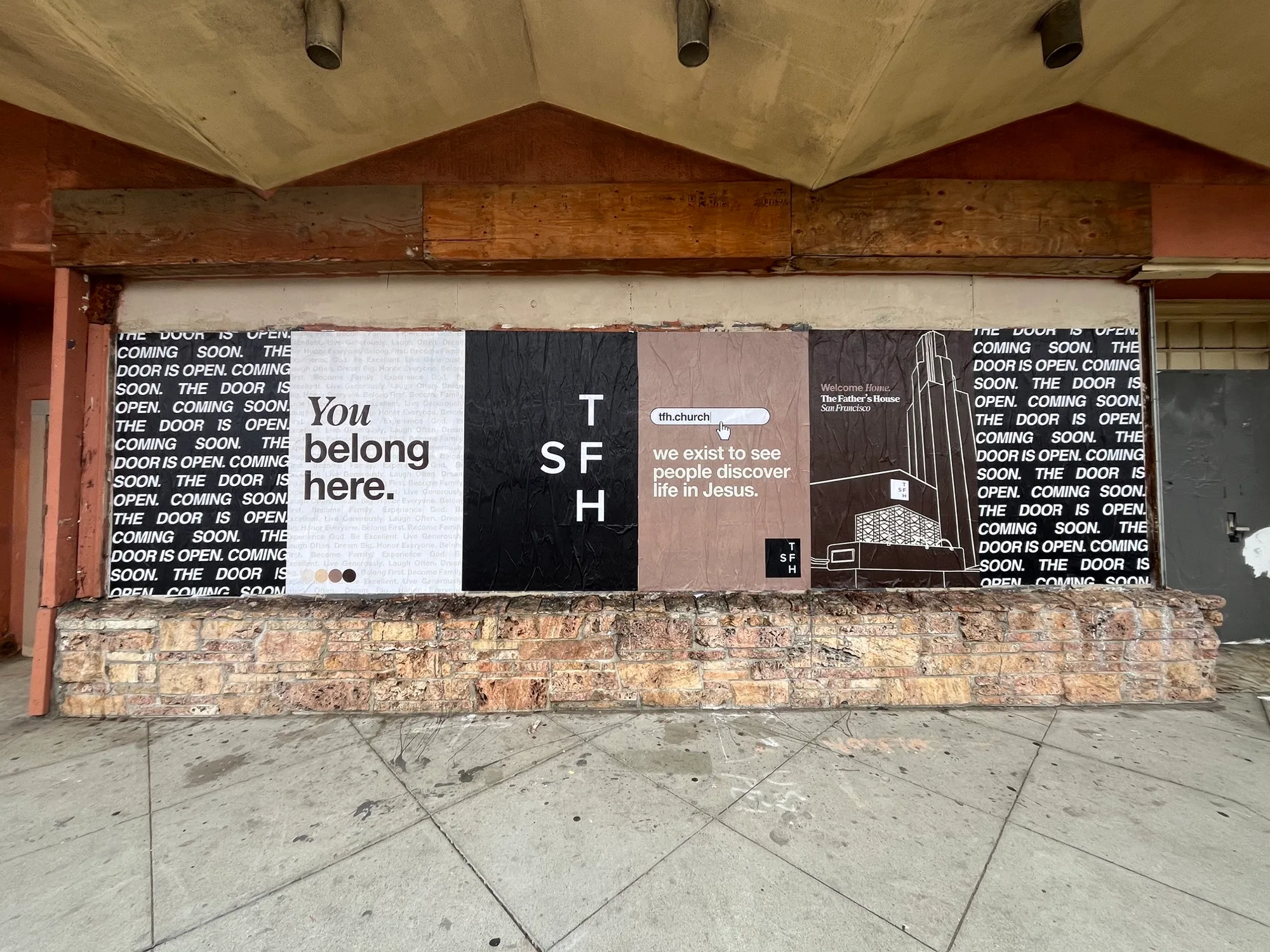 Jumbo custom-branded posters for The Father's House SF covering a street-level wall on Ocean Avenue in San Francisco, CA by Beyond Street Media