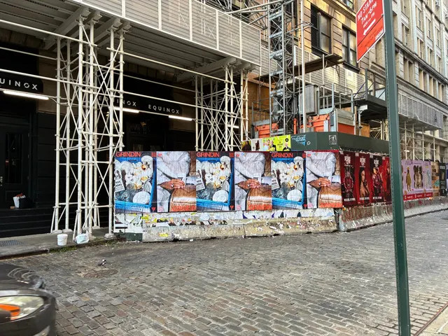 Grindin jumbo wheatpaste poster on a construction hoarding in New York City, installed by Beyond Street Media (photo 30 of 337).