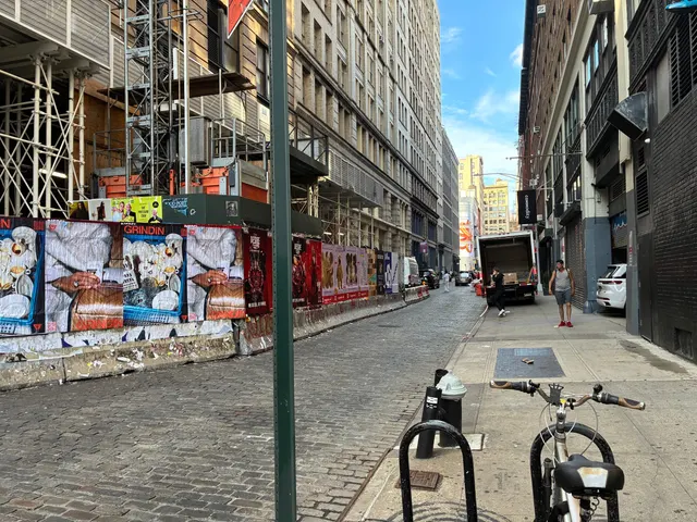 Grindin jumbo wheatpaste poster on a construction hoarding in New York City, installed by Beyond Street Media (photo 31 of 337).
