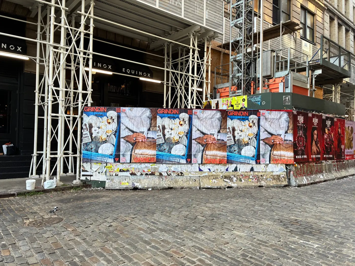 Grindin jumbo wheatpaste poster on a construction hoarding in New York City, installed by Beyond Street Media (photo 2 of 337).