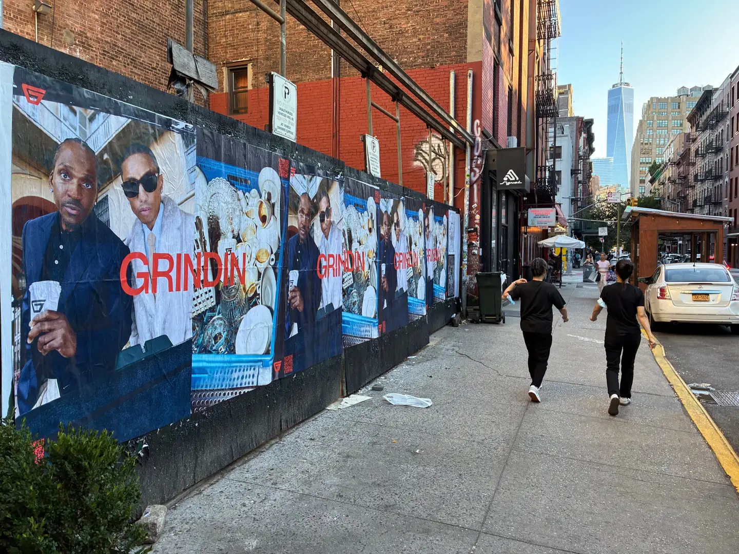 Grindin jumbo wheatpaste poster on a construction hoarding in New York City, installed by Beyond Street Media