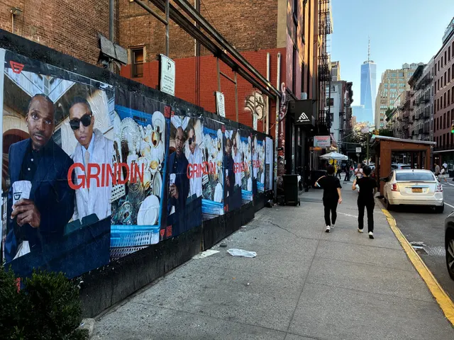 Grindin jumbo wheatpaste poster on a construction hoarding in New York City, installed by Beyond Street Media (photo 23 of 337).