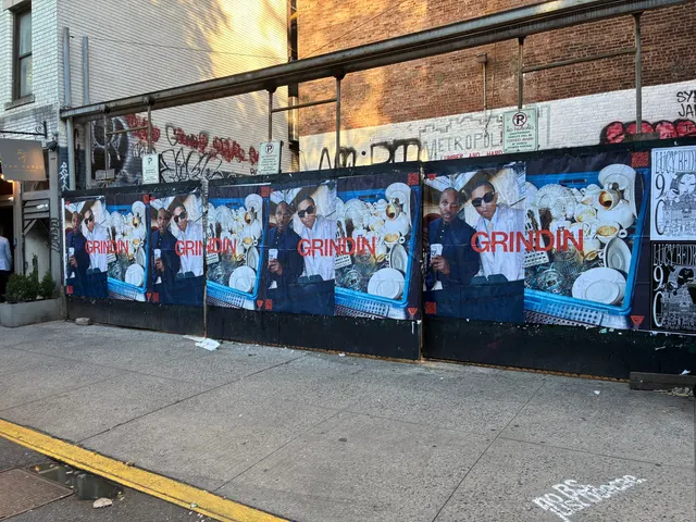 Grindin jumbo wheatpaste poster on a construction hoarding in New York City, installed by Beyond Street Media (photo 12 of 337).