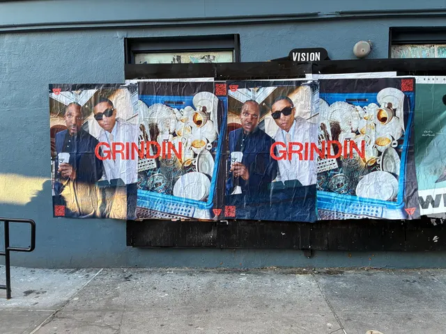 Grindin jumbo wheatpaste poster on a construction hoarding in New York City, installed by Beyond Street Media (photo 19 of 337).
