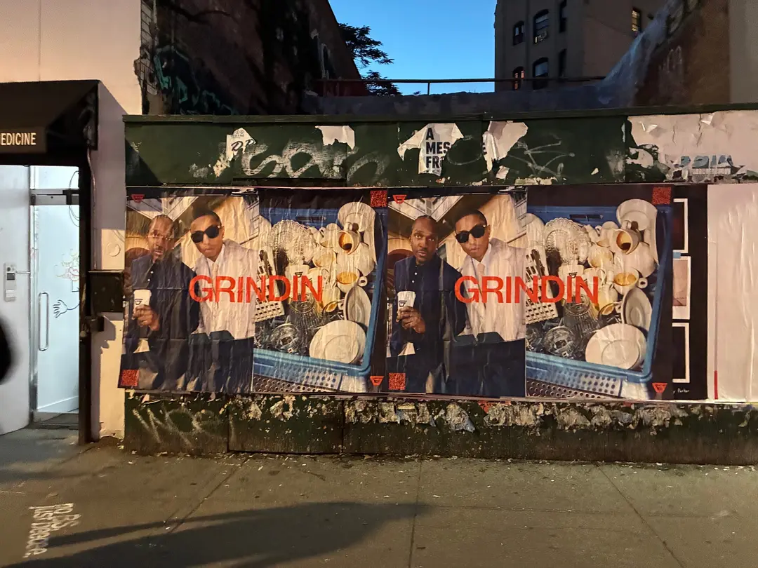 Grindin jumbo wheatpaste poster on a construction hoarding in New York City, installed by Beyond Street Media (photo 5 of 337).