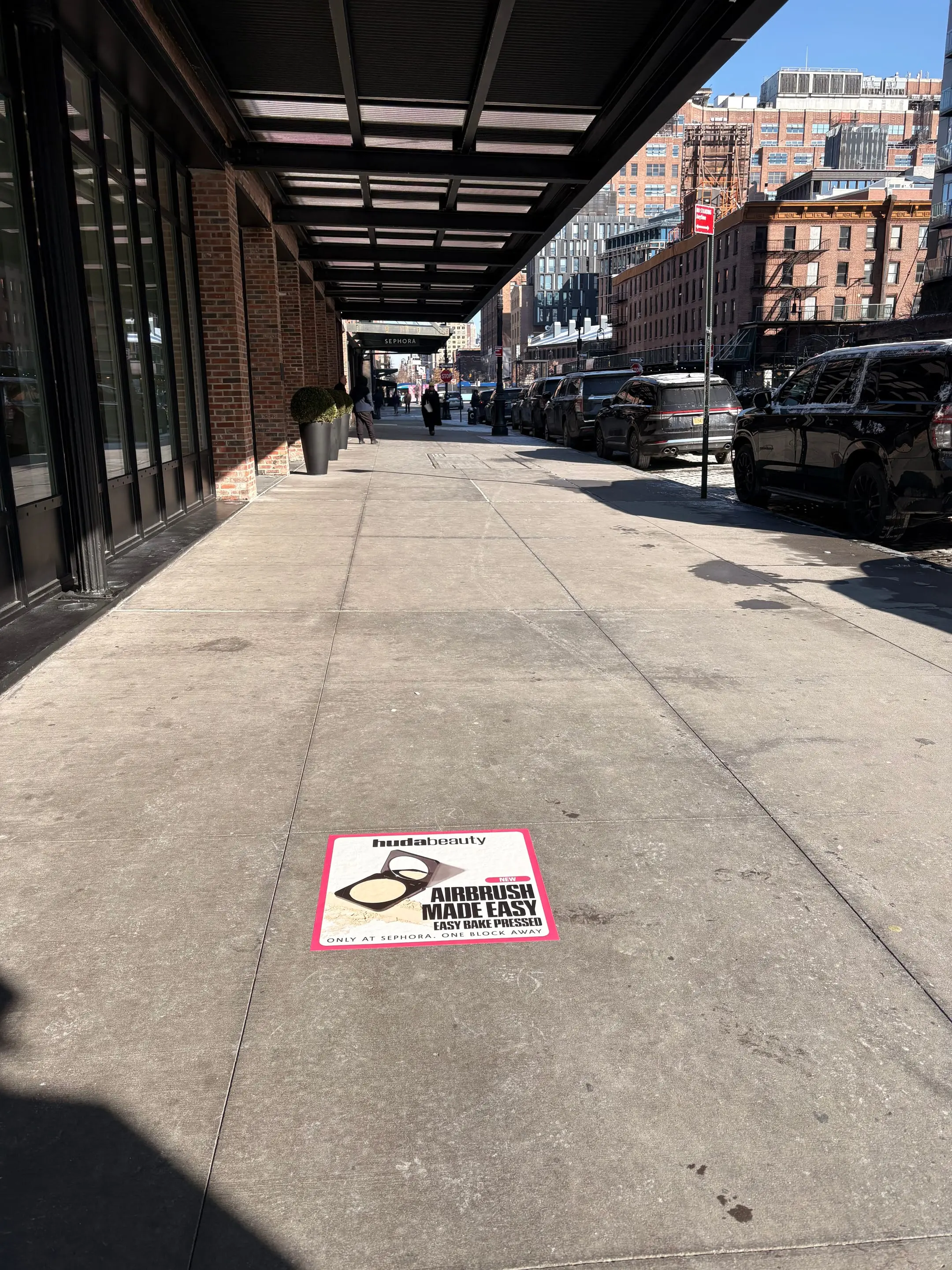 Huda Beauty sidewalk decal in New York City, New York City by Beyond Street Media