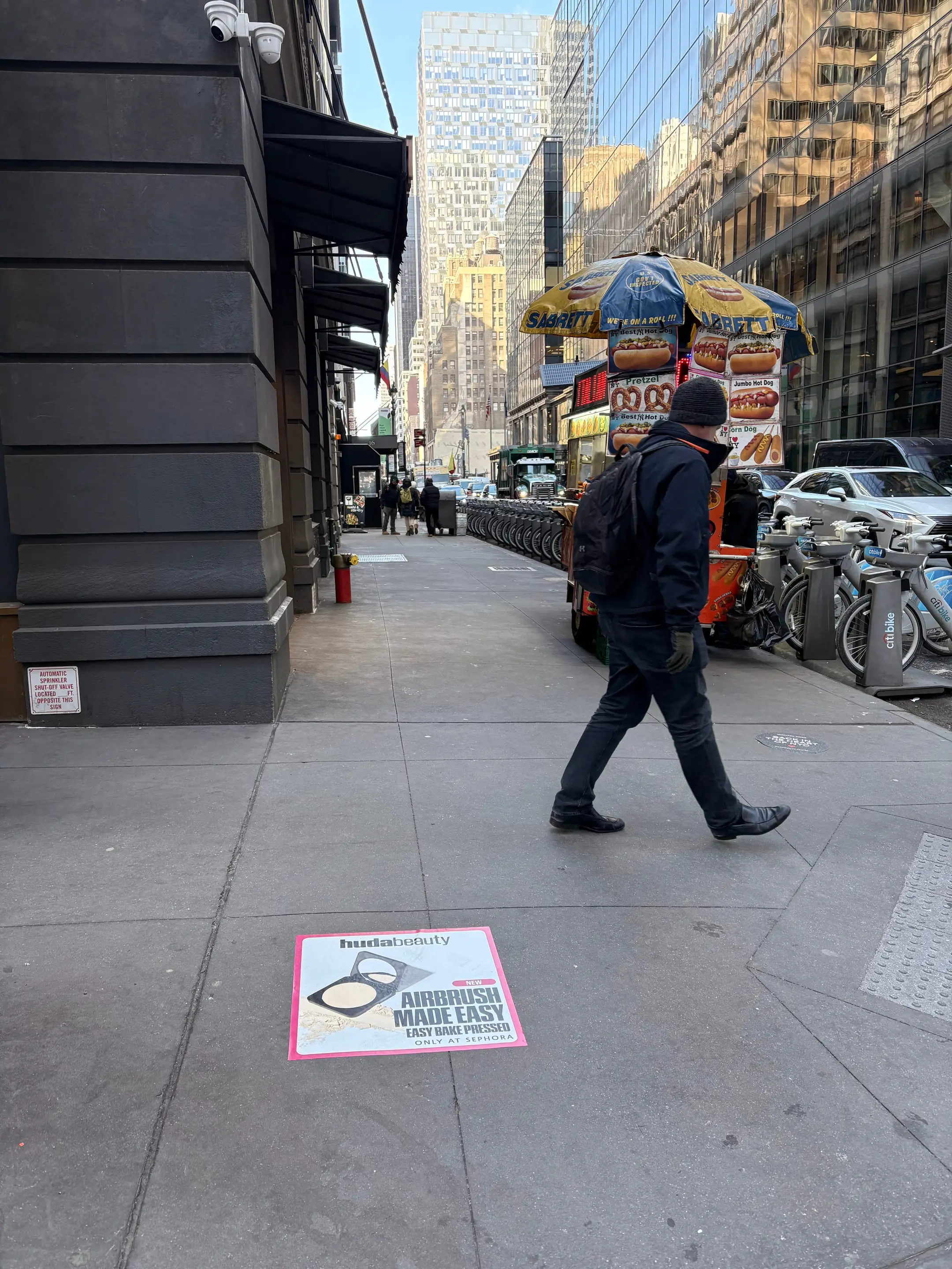Huda Beauty sidewalk decal in New York City, New York City by Beyond Street Media