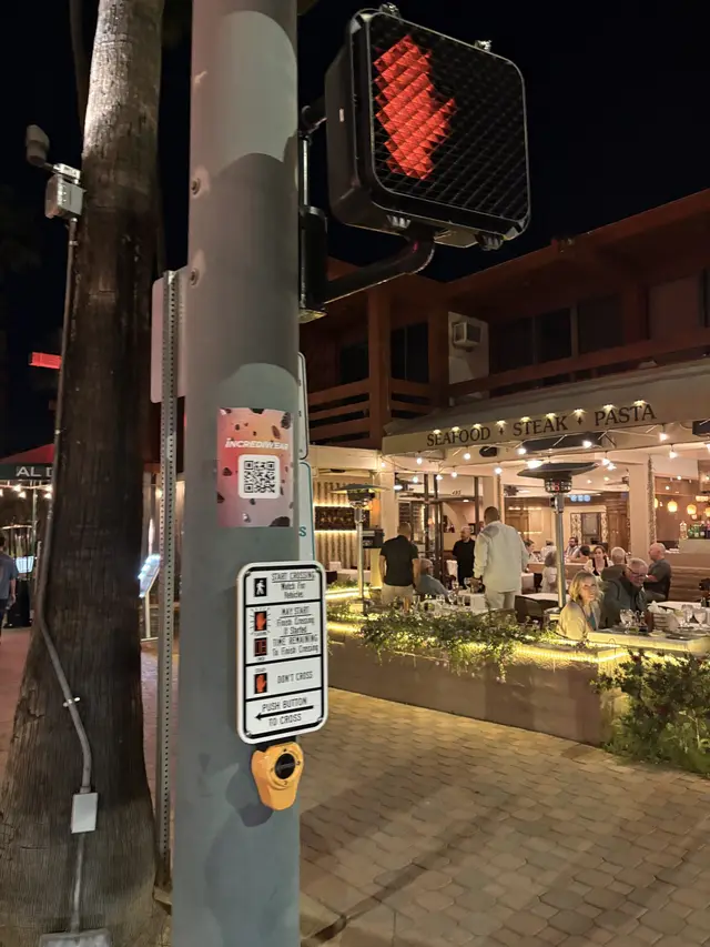 Incrediwear pull-tab QR pole sticker in the Coachella Valley during the BNP Paribas Open, documented street install, by Beyond Street Media (photo 6 of 38).