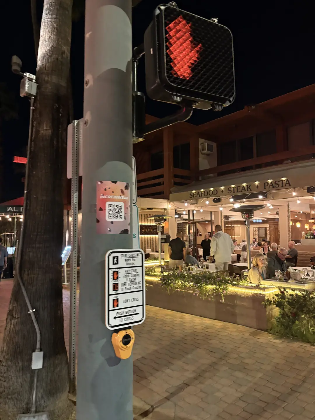 Incrediwear pull-tab QR pole sticker in the Coachella Valley during the BNP Paribas Open, documented street install, by Beyond Street Media (photo 6 of 38).