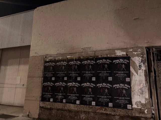 Johnny Blue Skies wheatpaste show poster in downtown Phoenix by Beyond Street Media (photo 23 of 31).