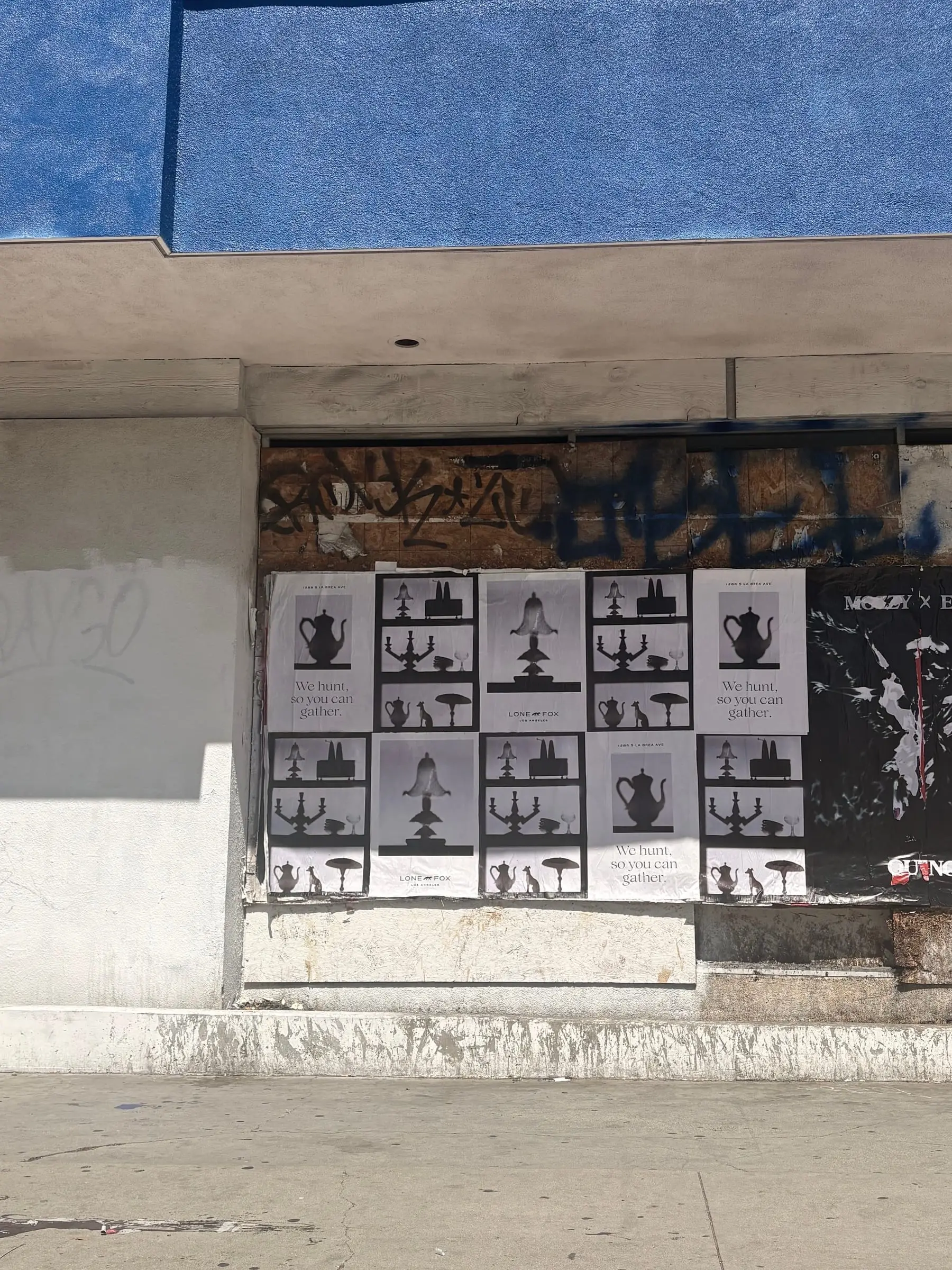 Lone Fox 'We hunt, so you can gather' wheatpaste poster campaign on documented walls in Los Angeles, CA by Beyond Street Media