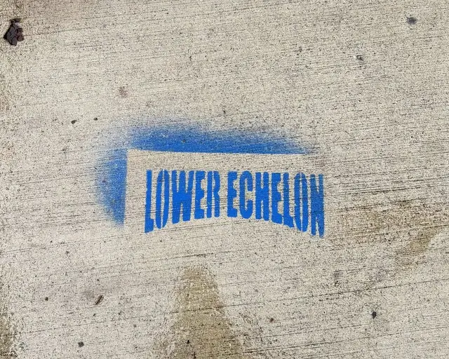 Lower Echelon brand sidewalk stencil in New York City, NY by Beyond Street Media