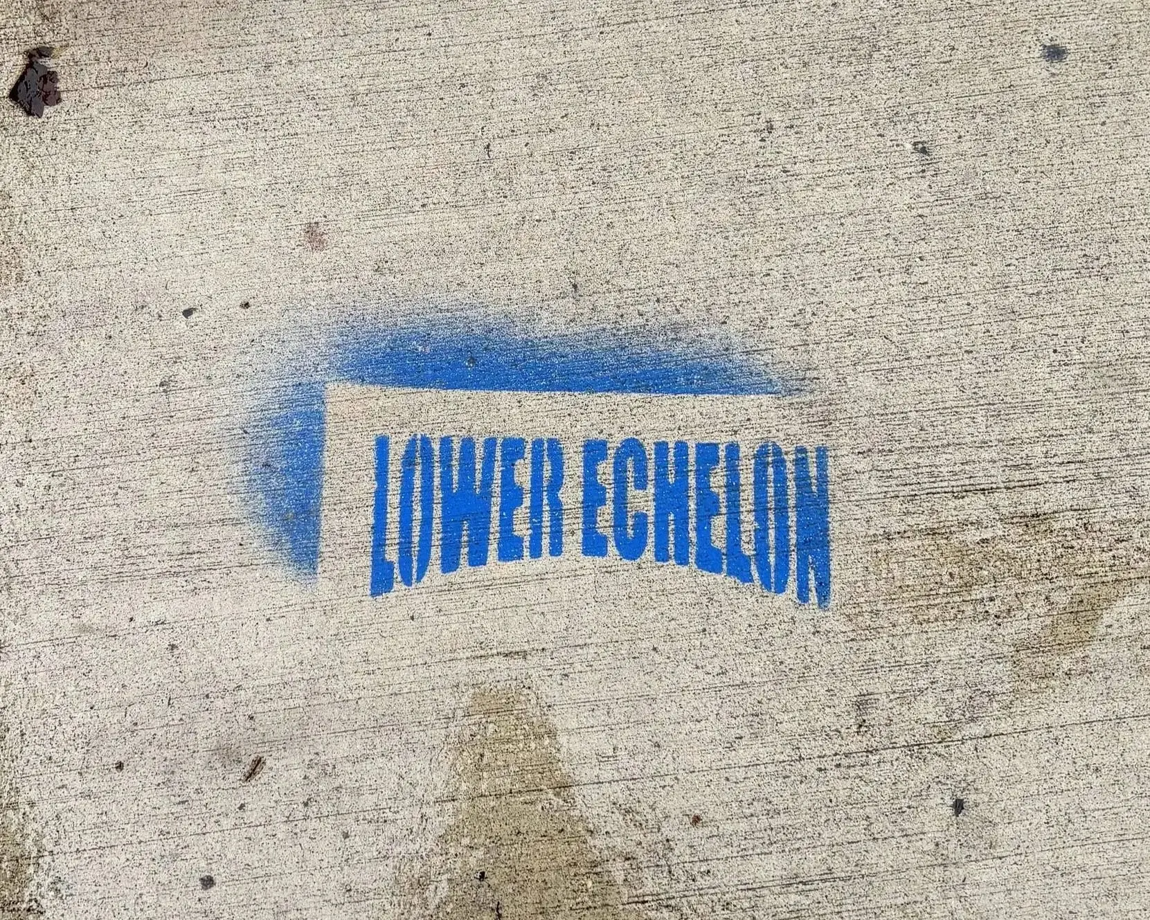 Lower Echelon brand sidewalk stencil in New York City, NY by Beyond Street Media