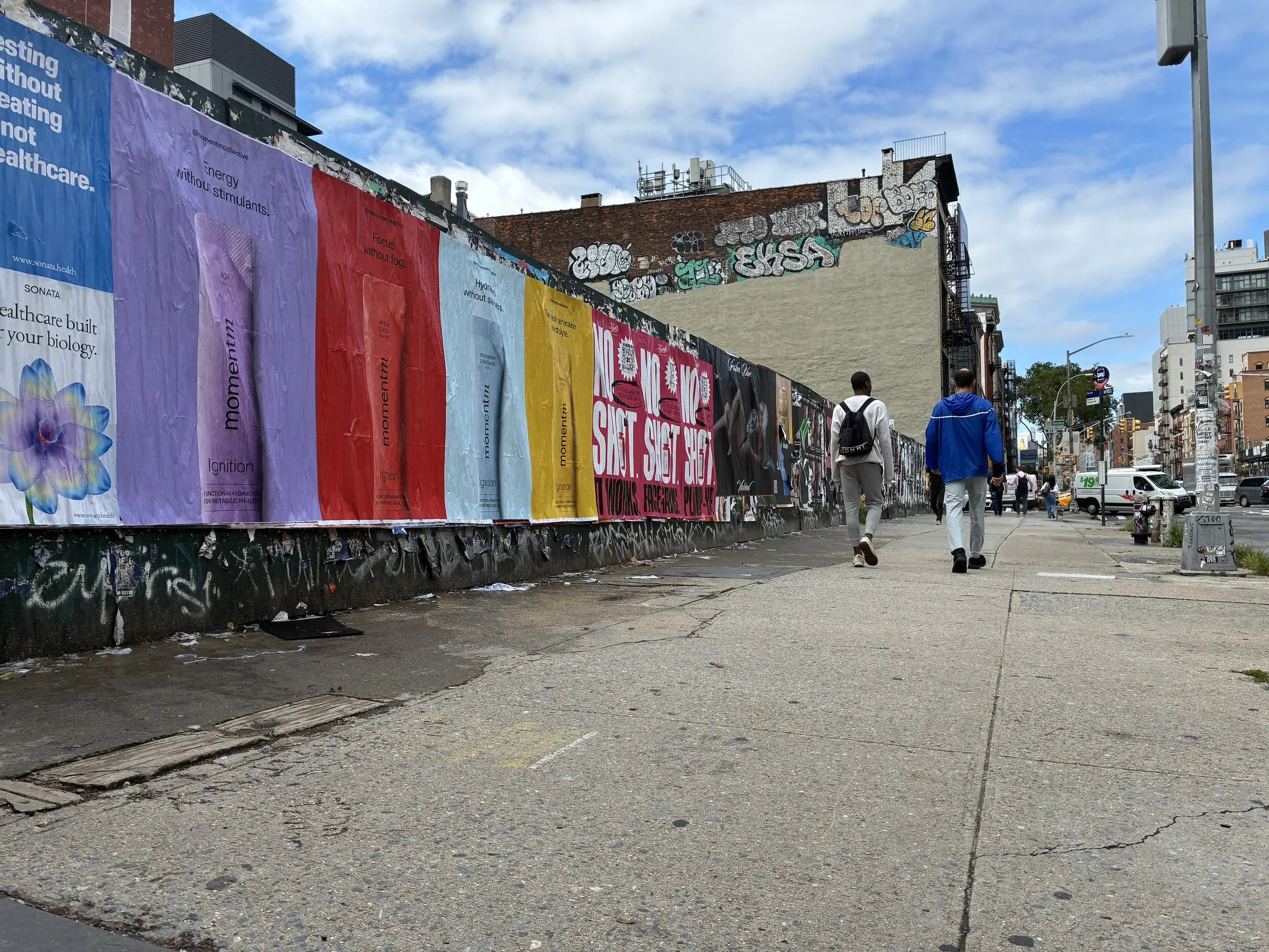Momentm wheatpaste, stencil and takeaway poster campaign across SoHo, the Lower East Side and Williamsburg by Beyond Street Media