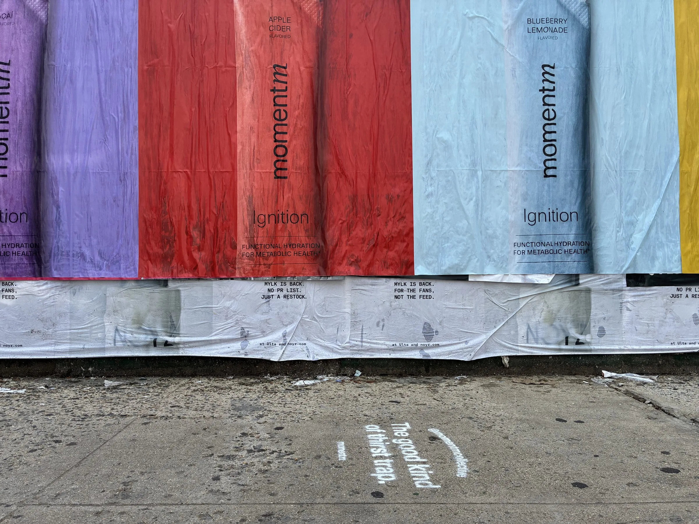 Momentm wheatpaste, stencil and takeaway poster campaign across SoHo, the Lower East Side and Williamsburg by Beyond Street Media