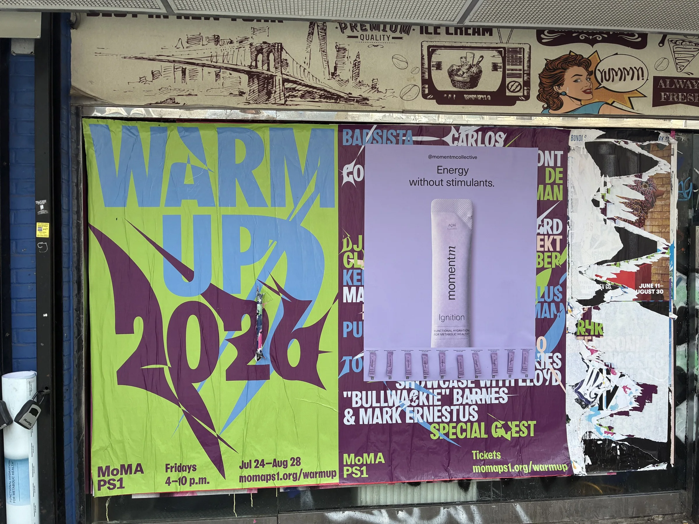 Momentm takeaway poster in lavender with sample stick packs pasted into a South Williamsburg poster wall.