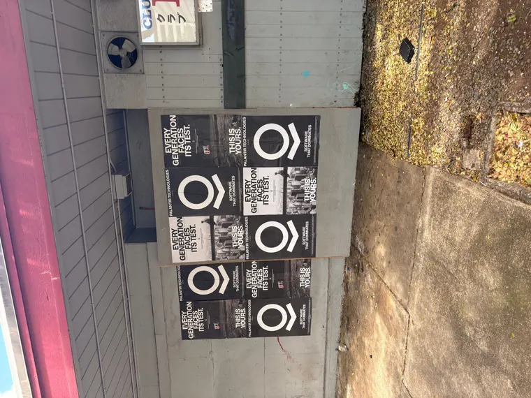 Wheatpaste poster install for Palantir Technologies on Honolulu, HI in Honolulu, HI, black-and-white 'Every Generation Faces Its Test / This Is Yours' paste-up poster install by Beyond Street Media