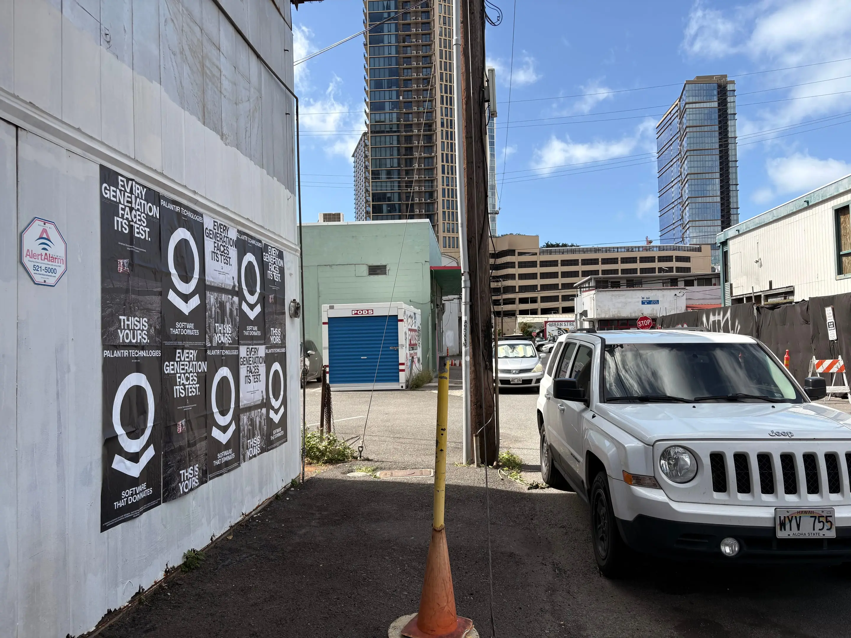 Wheatpaste poster install for Palantir Technologies on Honolulu, HI in Honolulu, HI, black-and-white 'Every Generation Faces Its Test / This Is Yours' paste-up poster install by Beyond Street Media