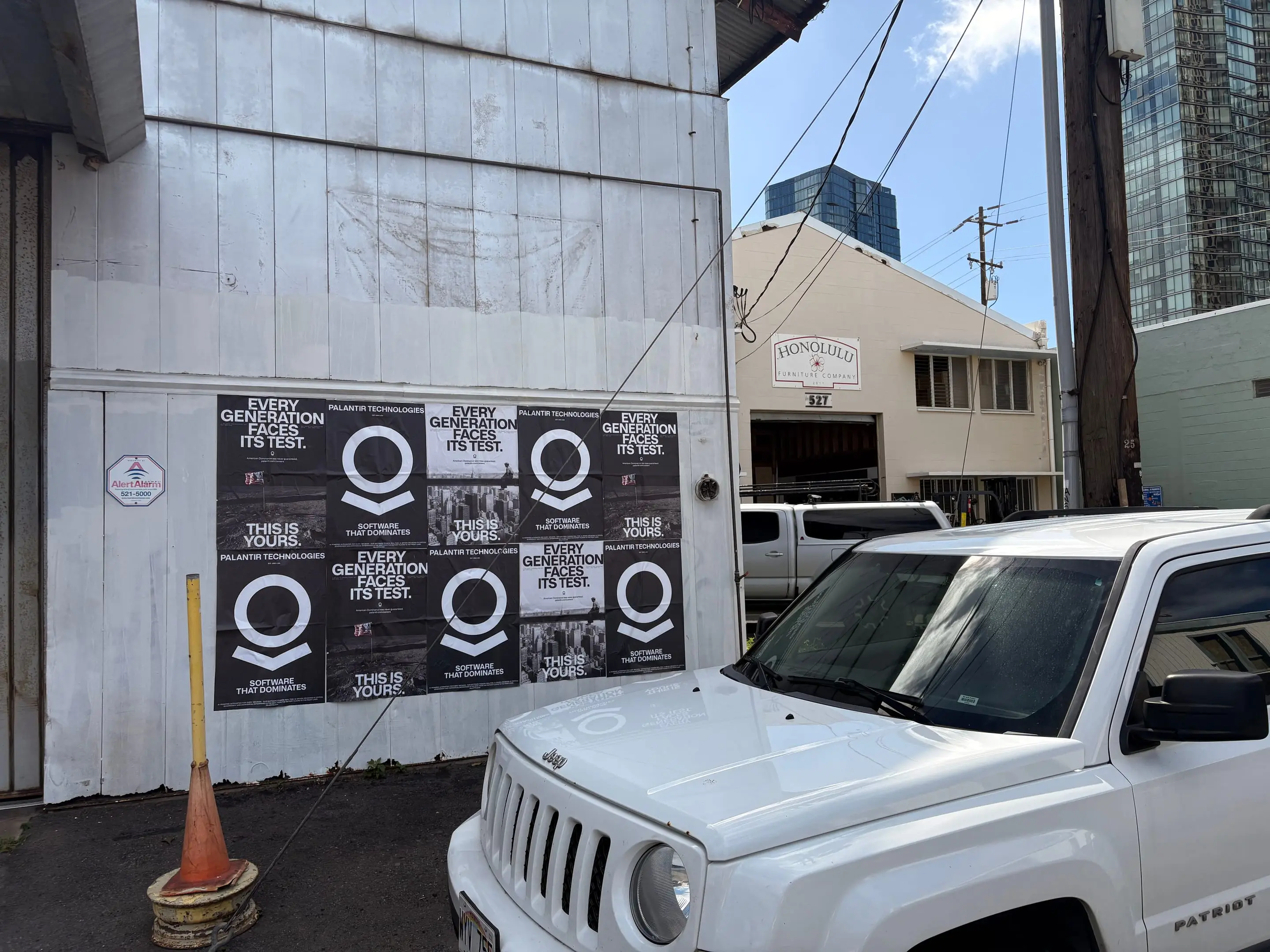 Wheatpaste poster install for Palantir Technologies on Honolulu, HI in Honolulu, HI, black-and-white 'Every Generation Faces Its Test / This Is Yours' paste-up poster install by Beyond Street Media
