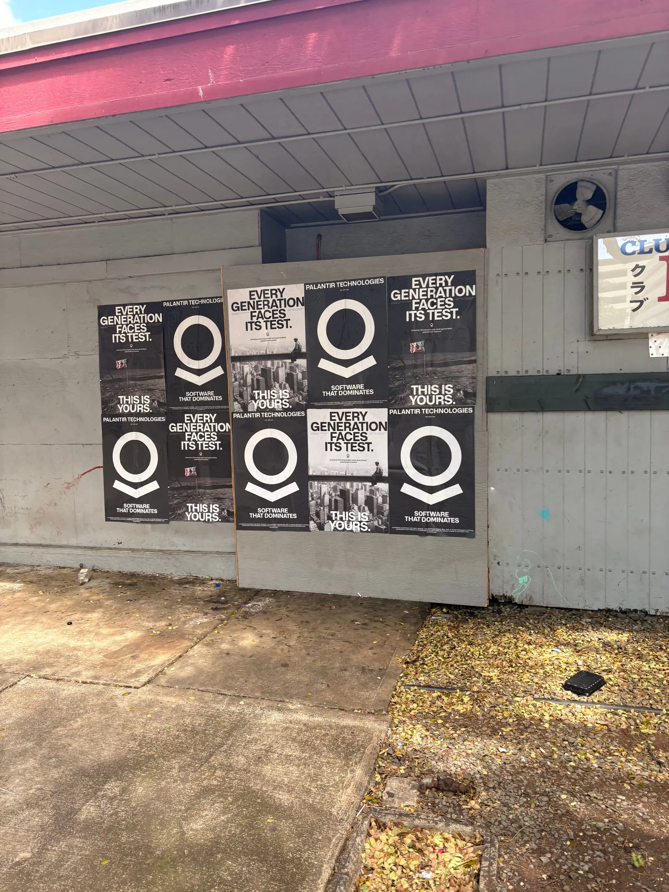 Wheatpaste poster install for Palantir Technologies on Honolulu, HI in Honolulu, HI, black-and-white 'Every Generation Faces Its Test / This Is Yours' paste-up poster install by Beyond Street Media