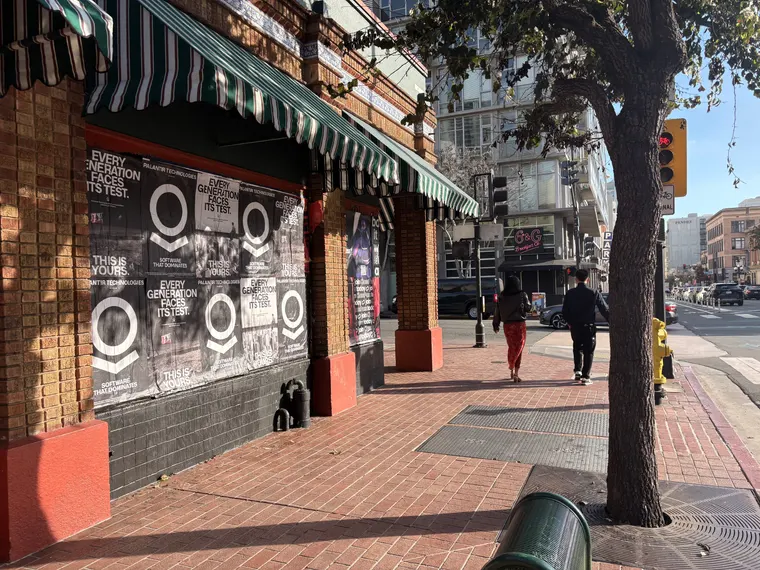 Wheatpaste poster install for Palantir Technologies on San Diego, CA in San Diego, CA, black-and-white 'Every Generation Faces Its Test / This Is Yours' paste-up poster install by Beyond Street Media