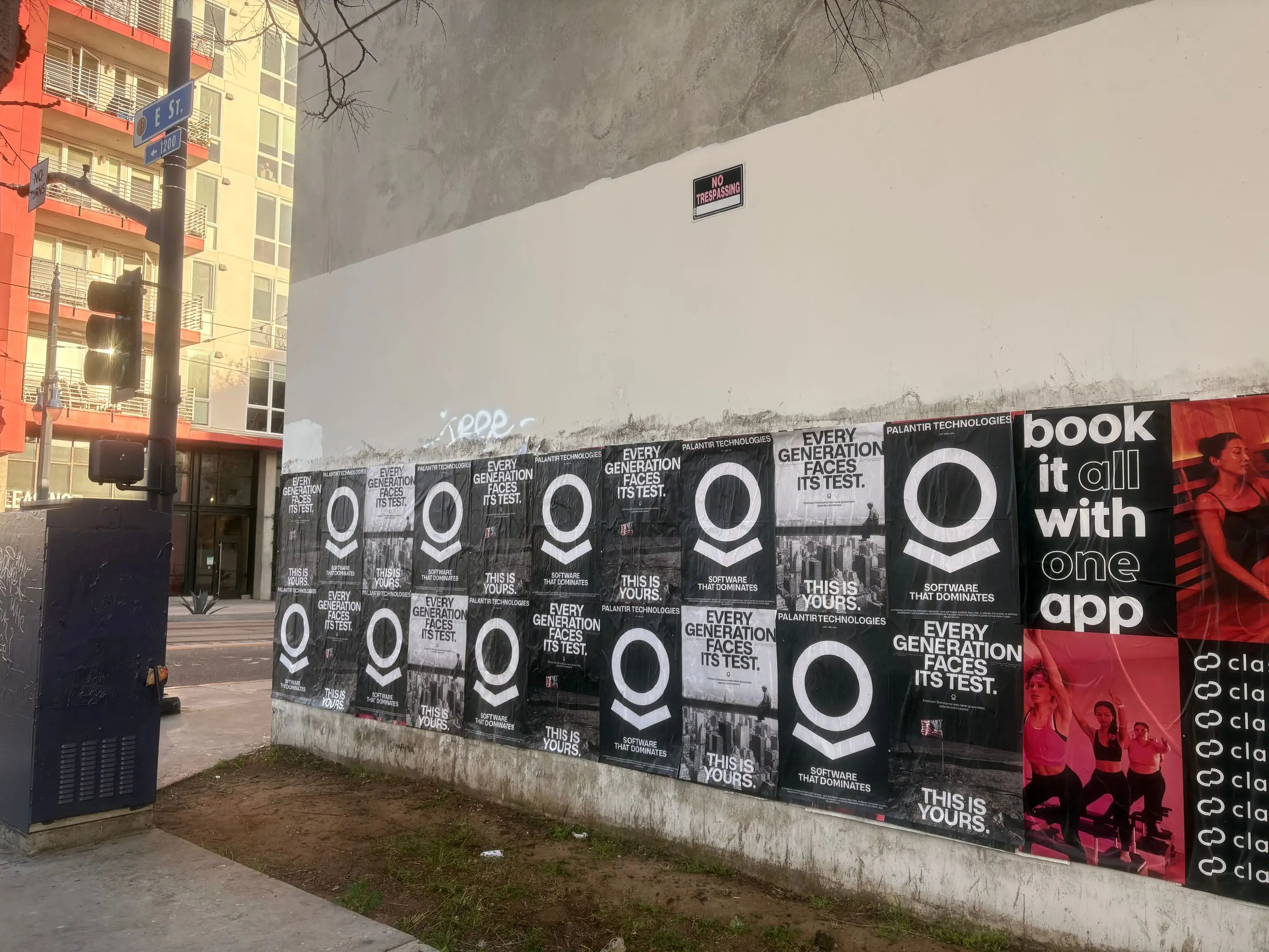 Wheatpaste poster install for Palantir Technologies on San Diego, CA in San Diego, CA, black-and-white 'Every Generation Faces Its Test / This Is Yours' paste-up poster install by Beyond Street Media
