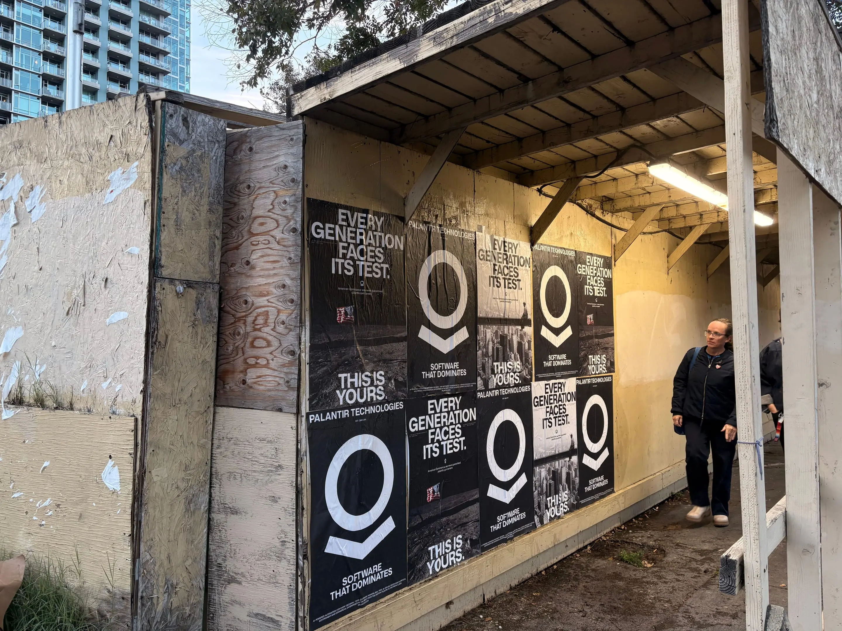 Wheatpaste poster install for Palantir Technologies on San Diego, CA in San Diego, CA, black-and-white 'Every Generation Faces Its Test / This Is Yours' paste-up poster install by Beyond Street Media