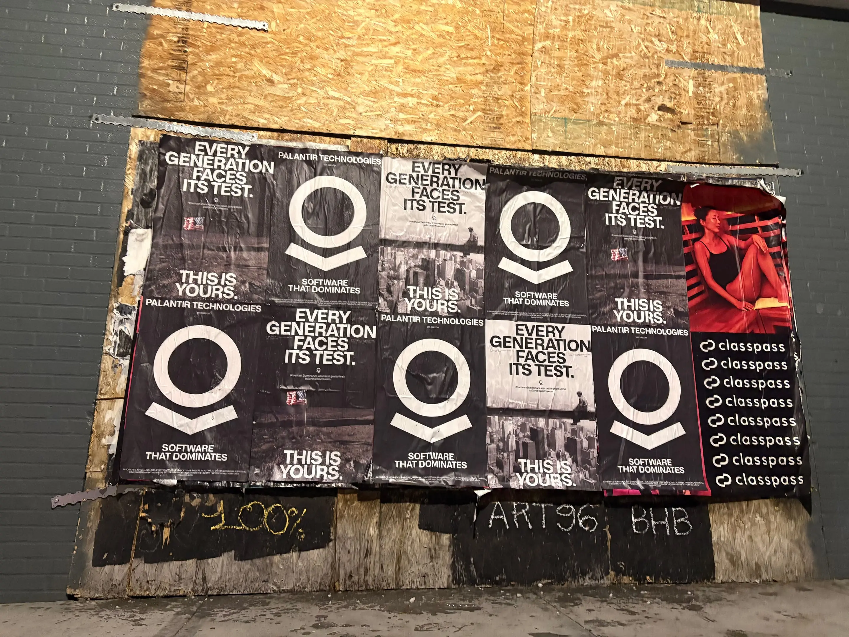 Wheatpaste poster install for Palantir Technologies on San Diego, CA in San Diego, CA, black-and-white 'Every Generation Faces Its Test / This Is Yours' paste-up poster install by Beyond Street Media
