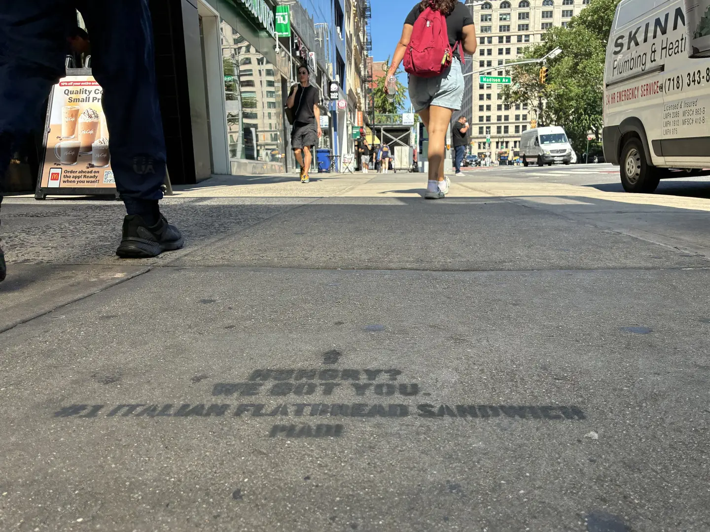 PIADI chalk stencil reading Hungry? We got you, number one Italian flatbread sandwich, on a Manhattan sidewalk.
