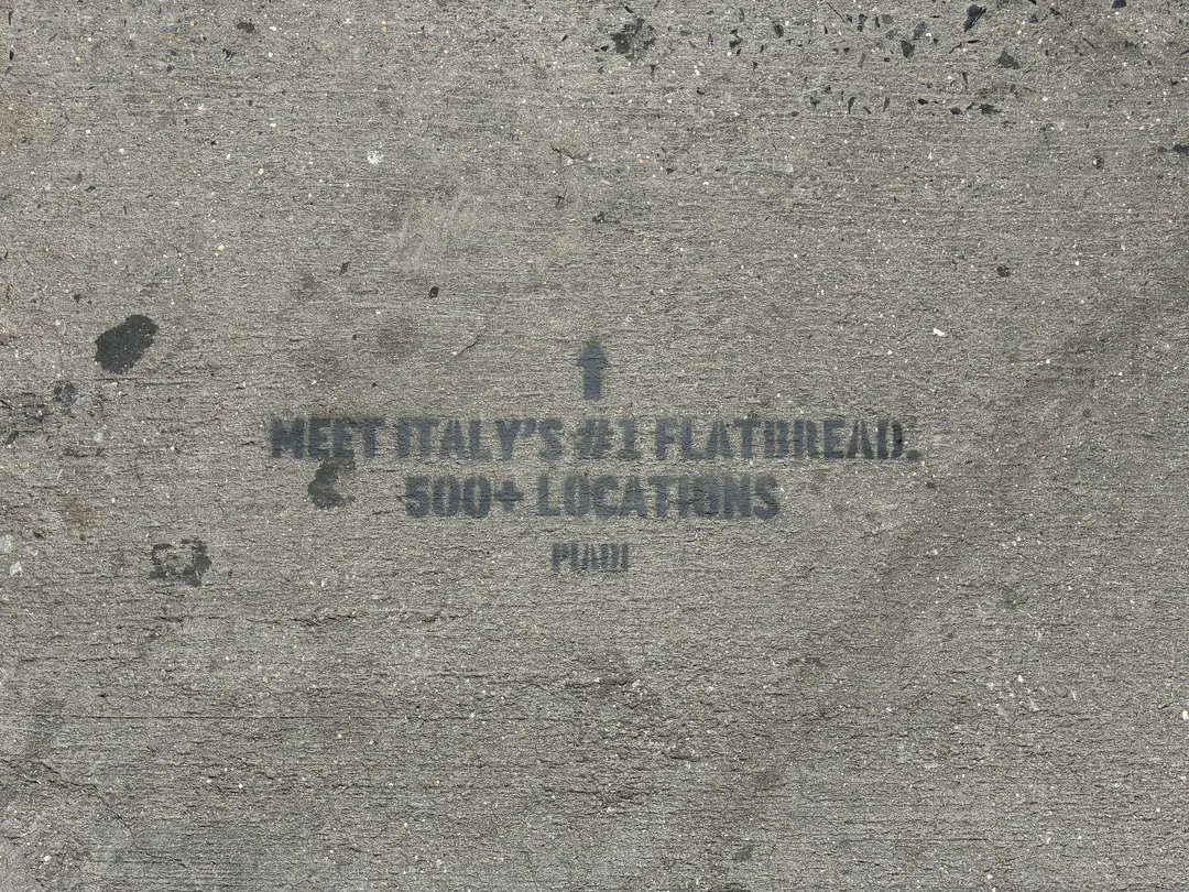PIADI chalk stencil reading Meet Italy's number one flatbread, 500 plus locations.