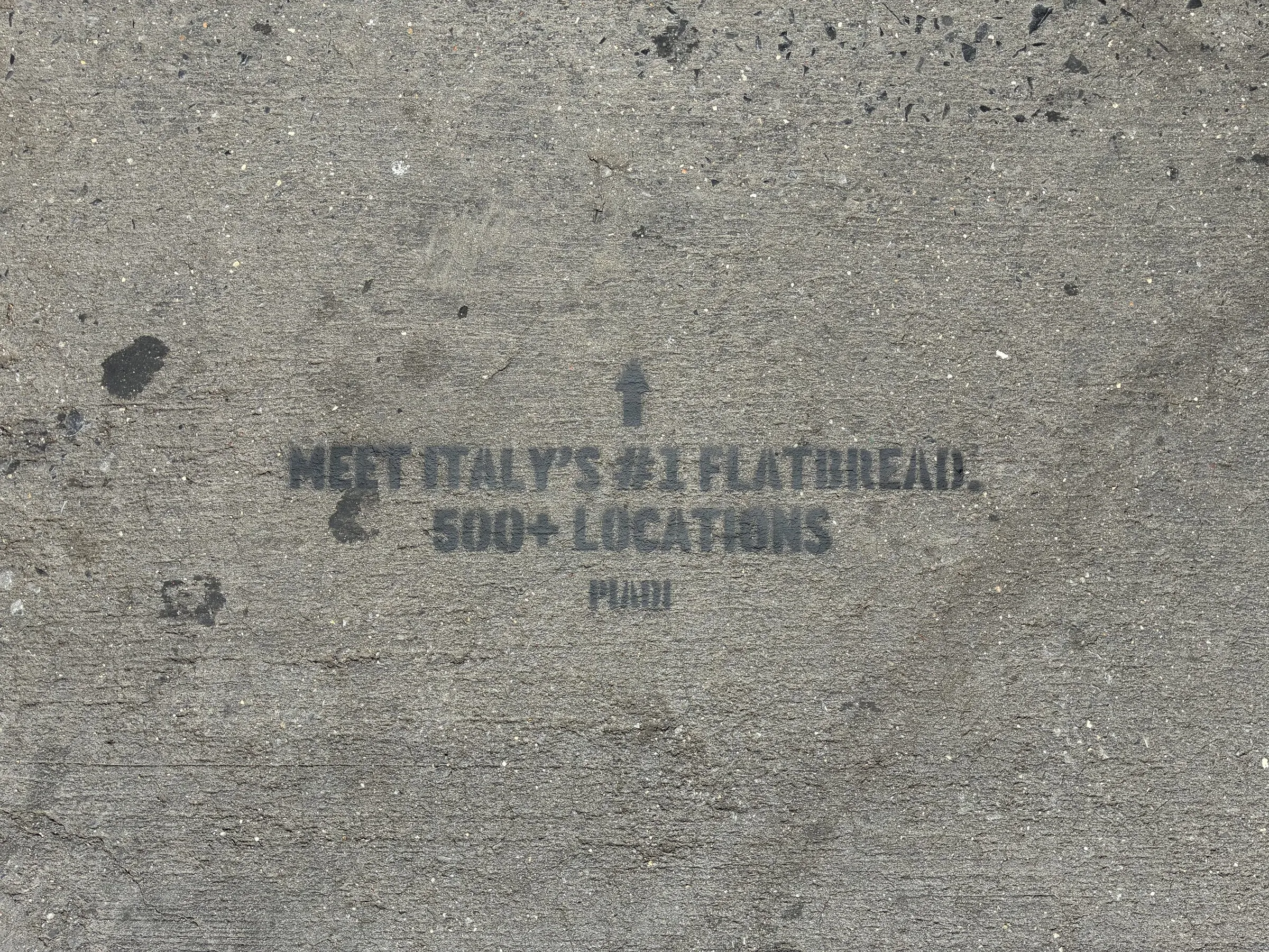 PIADI chalk stencil reading Meet Italy's number one flatbread, 500 plus locations.