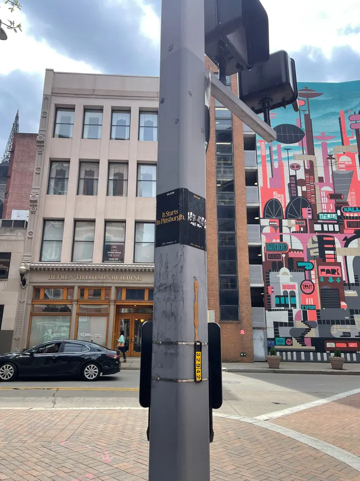 Pole sticker campaign for 'It Starts In Pittsburgh' on city light poles in Pittsburgh, PA by Beyond Street Media