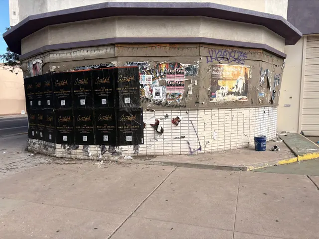 Red Clay Strays wheatpaste show poster in downtown Phoenix by Beyond Street Media (photo 18 of 24).